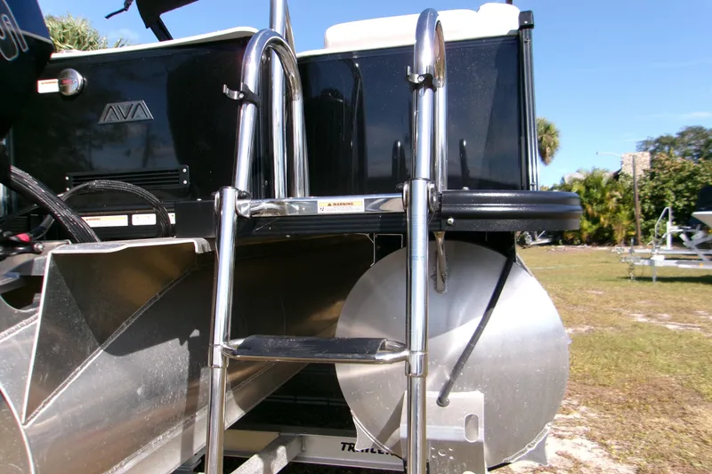 Slide: The Image of 2025 Avalon 2585 Quad Lounger boat with stainless steel ladder and pontoon detail. - 23