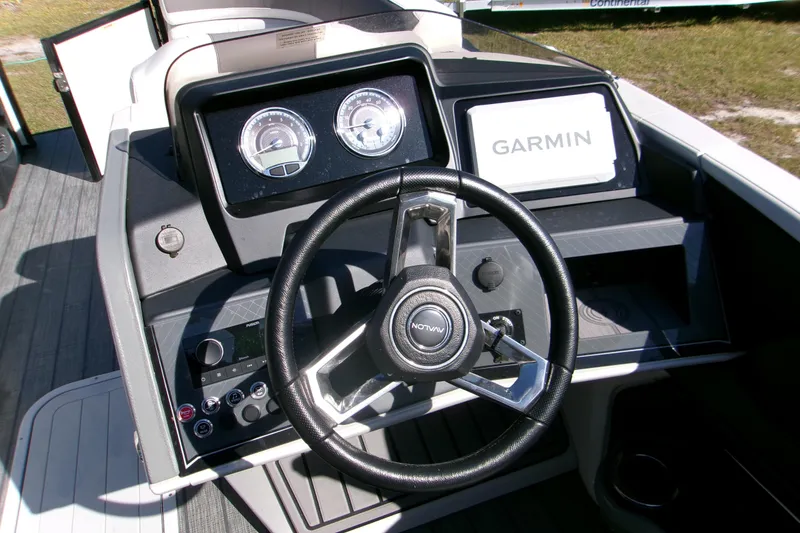 Slide: The Image of Steering console of 2025 Avalon 2585 Quad Lounger with Garmin navigation system. - 7