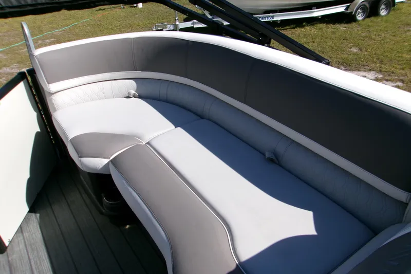 Slide: The Image of 2025 Avalon 2585 Quad Lounger boat seating, featuring sleek gray and white upholstery. - 8
