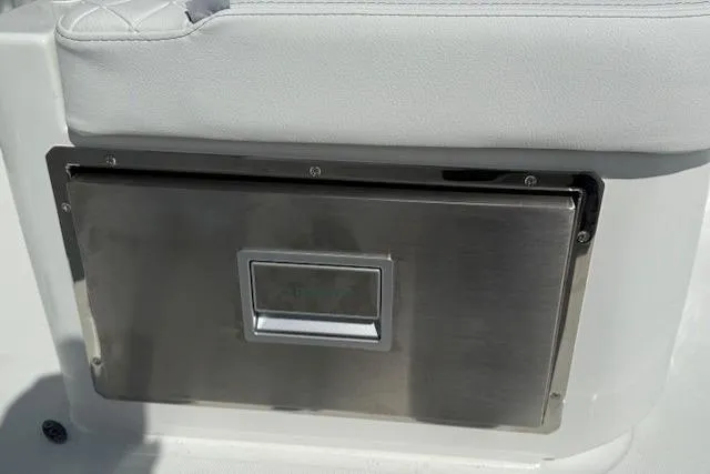 Slide: The Image of 2026 Wellcraft 38 T-Top boat seat with stainless steel storage compartment. - 12