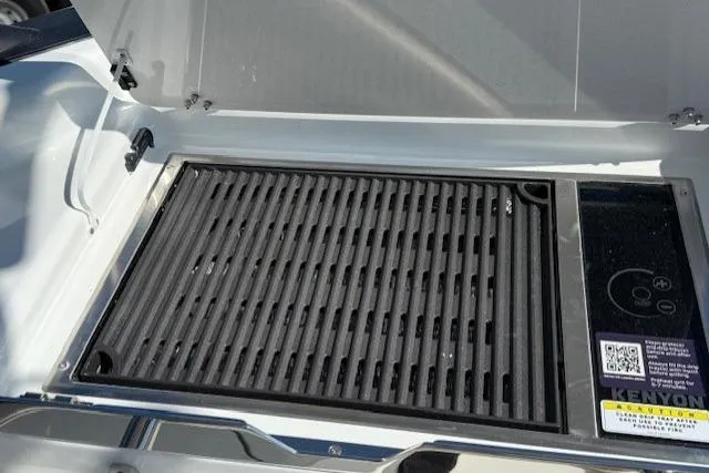 Slide: The Image of Built-in grill on 2026 Wellcraft 38 T-Top boat, featuring Kenyon electric cooktop. - 13