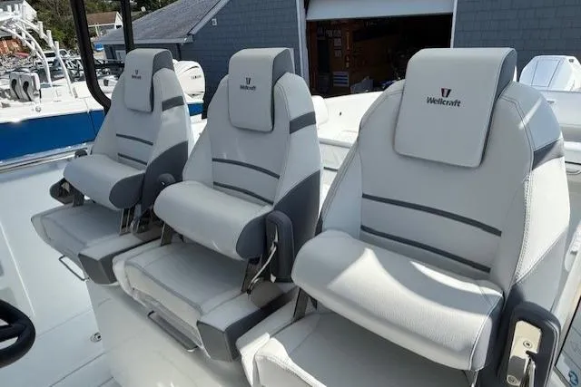 Slide: The Image of Three Wellcraft 38 T-Top 2026 boat seats in sleek, modern design. - 16