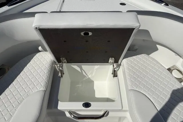 Slide: The Image of 2026 Wellcraft 38 T-Top boat with open storage compartment and quilted seating. - 25