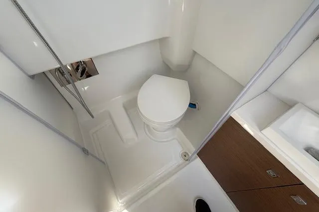 Slide: The Image of 2026 Wellcraft 38 T-Top boat bathroom with modern fixtures and compact design. - 34