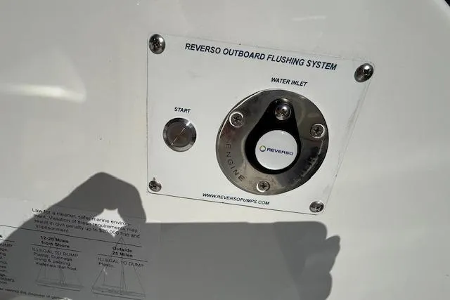Slide: The Image of Reverso outboard flushing system on 2026 Wellcraft 38 T-Top boat. - 6