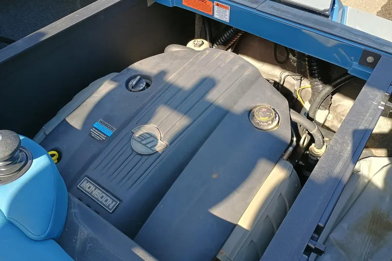 Slide: The Image of 2022 Axis A22 boat engine compartment with Monsoon engine visible. - 8