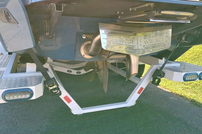 Slide: The Image of 2022 Axis A22 boat with Power Wedge III, rear view showing propeller and swim platform. - 9