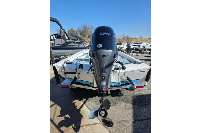 Slide: The Image of 2026 Xpress H22B Bay boat with 175 horsepower outboard motor, rear view. - 10