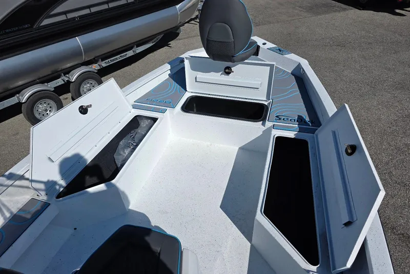 Slide: The Image of 2026 Xpress H22B Bay boat interior with open storage compartments and seating. - 14