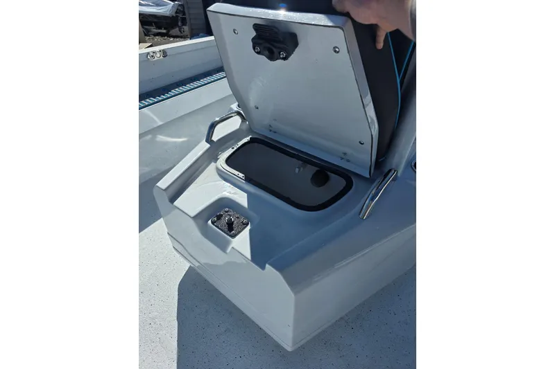 Slide: The Image of Open storage compartment on 2026 Xpress H22B Bay boat. - 21