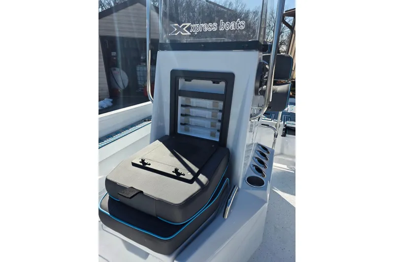 Slide: The Image of 2026 Xpress H22B Bay boat interior with storage compartments and seating. - 22