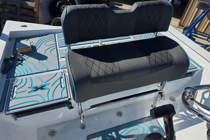 Slide: The Image of 2026 Xpress H22B Bay boat interior with stylish seating and storage compartments. - 25