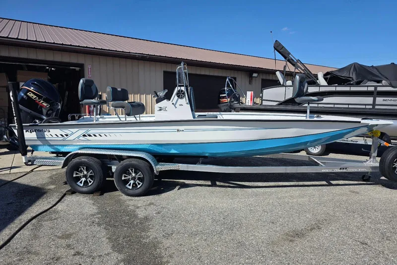 The Image of 2026 Xpress H22B Bay boat on trailer, parked outdoors. - 6