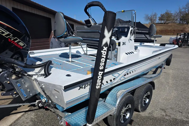 Slide: The Image of 2026 Xpress H22B Bay boat on trailer, featuring sleek design and powerful engine. - 8