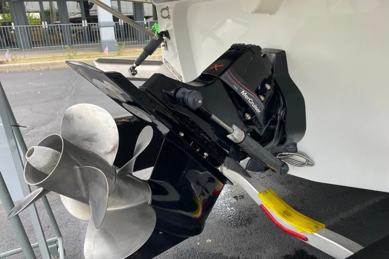 Slide: The Image of 2015 Crownline 305 SS boat with MerCruiser engine and propeller detail. - 16