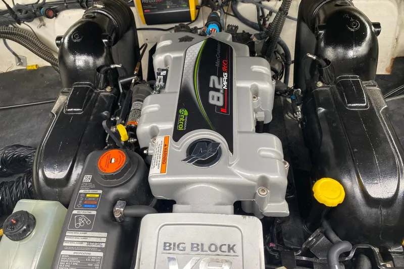 Slide: The Image of Engine of a 2015 Crownline 305 SS boat, featuring an 8.2 MAG engine. - 18