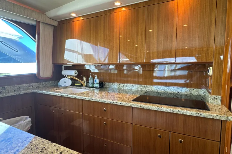 Slide: The Image of Luxurious kitchen interior of 2006 Viking 56 Convertible yacht with granite countertops. - 17