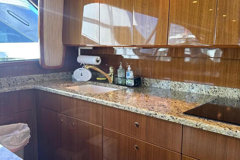 Slide: The Image of Luxurious kitchen interior of 2006 Viking 56 Convertible yacht with granite countertops. - 18