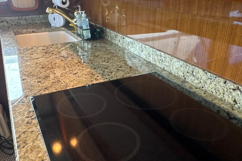 Slide: The Image of Granite countertop and stove in 2006 Viking 56 Convertible yacht kitchen. - 19