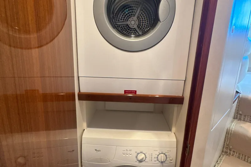 Slide: The Image of Stacked washer and dryer in 2006 Viking 56 Convertible yacht interior. - 24