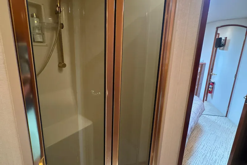 Slide: The Image of 2006 Viking 56 Convertible yacht interior with shower and cabin view. - 30