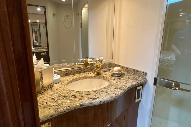 Slide: The Image of Luxurious bathroom in 2006 Viking 56 Convertible yacht with granite countertop and elegant fixtures. - 39
