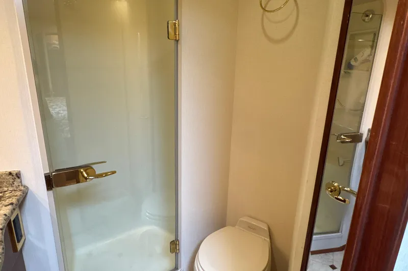 Slide: The Image of Bathroom interior of 2006 Viking 56 Convertible yacht with shower and toilet. - 40