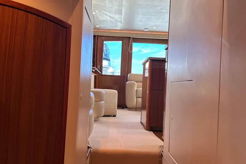 Slide: The Image of Interior view of 2006 Viking 56 Convertible yacht, featuring luxurious wood and leather furnishings. - 41
