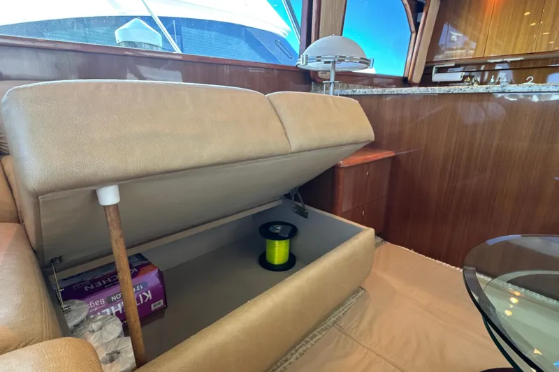 Slide: The Image of Interior of 2006 Viking 56 Convertible yacht with storage under seat. - 42