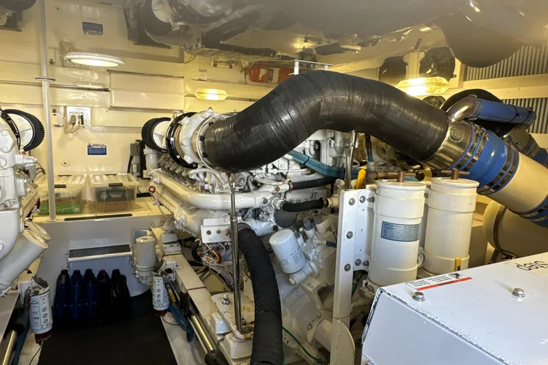 Slide: The Image of Engine room of a 2006 Viking 56 Convertible yacht, showcasing machinery and components. - 46