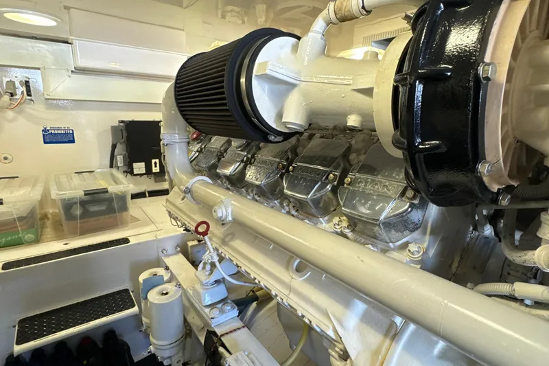 Slide: The Image of Engine room of a 2006 Viking 56 Convertible yacht, showcasing a powerful marine engine. - 51