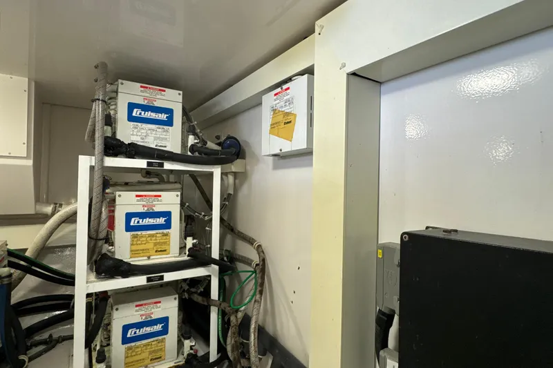 Slide: The Image of Engine room of 2006 Viking 56 Convertible with Cruisair units and wiring. - 53