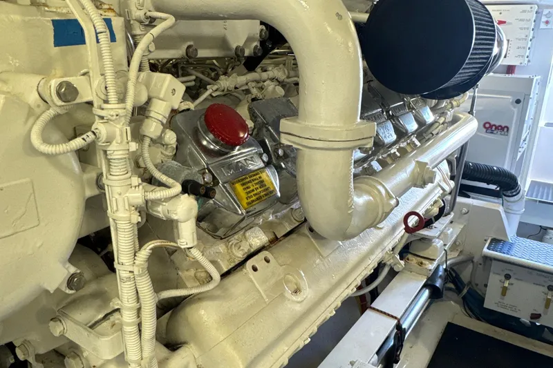Slide: The Image of Engine room of 2006 Viking 56 Convertible yacht, featuring detailed mechanical components. - 55