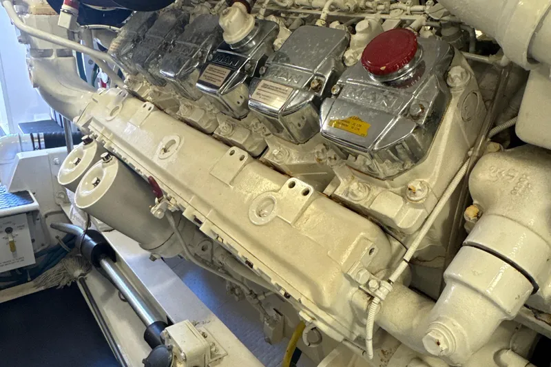 Slide: The Image of Engine room of a 2006 Viking 56 Convertible yacht, showcasing a powerful marine engine. - 56