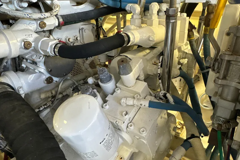 Slide: The Image of Engine room of 2006 Viking 56 Convertible yacht, showcasing complex machinery and components. - 57