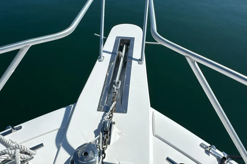 Slide: The Image of Bow of 2006 Viking 56 Convertible yacht with anchor chain and railing. - 71
