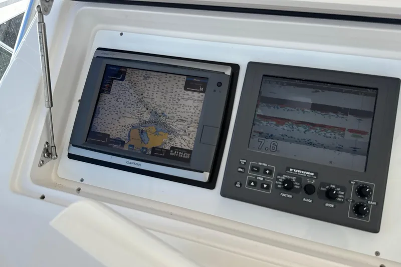 Slide: The Image of Navigation and sonar displays on a 2006 Viking 56 Convertible yacht. - 75