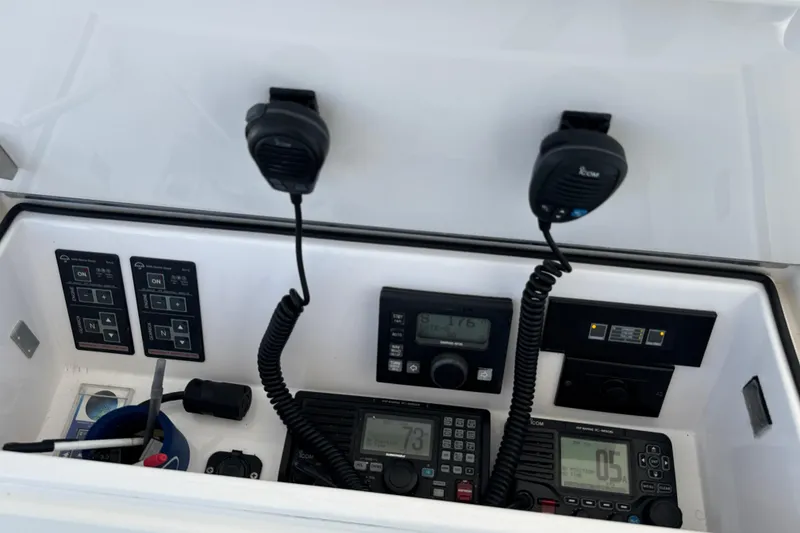 Slide: The Image of Control panel of a 2006 Viking 56 Convertible boat with communication equipment. - 76