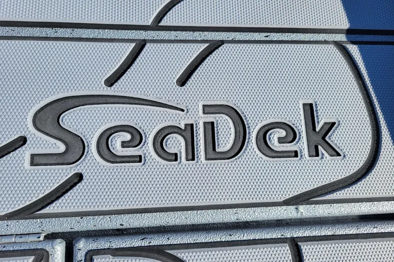 Slide: The Image of SeaDek logo on Xpress X23 Bay Lounge 2026 boat flooring. - 8