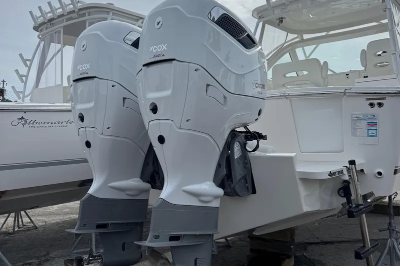 Slide: The Image of 2024 Albemarle 30 Express boat with twin Cox diesel outboard engines. - 2