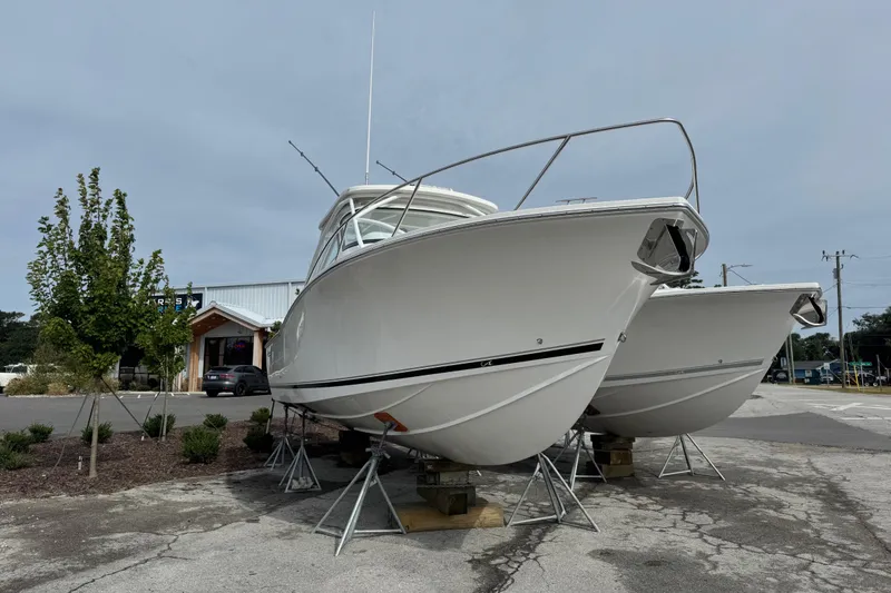 Slide: The Image of 2024 Albemarle 30 Express boats on stands in a parking lot. - 4
