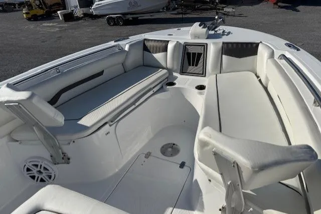 Slide: The Image of 2025 Wellcraft 223 Fisherman boat interior with white seating and modern design. - 13