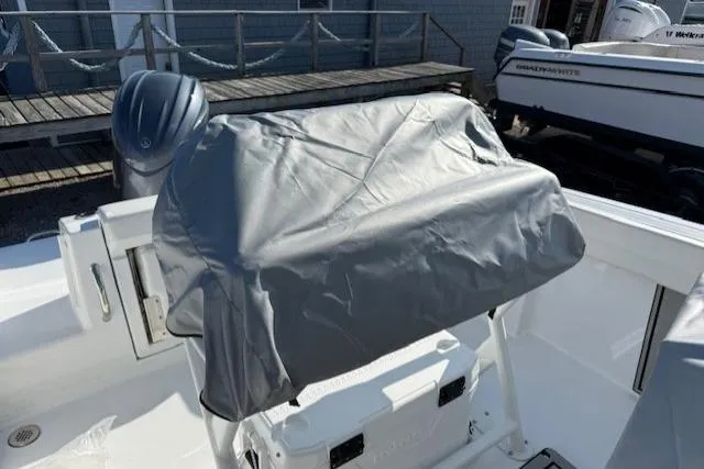 Slide: The Image of 2025 Wellcraft 223 Fisherman boat with covered console and outboard motor. - 14