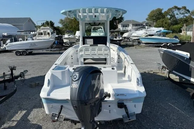 Slide: The Image of 2025 Wellcraft 223 Fisherman boat with Yamaha 200 engine, parked in a marina. - 4