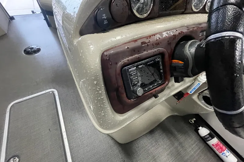 Slide: The Image of Dashboard of a 2020 South Bay 523E 2.75 boat with raindrops on windshield. - 13