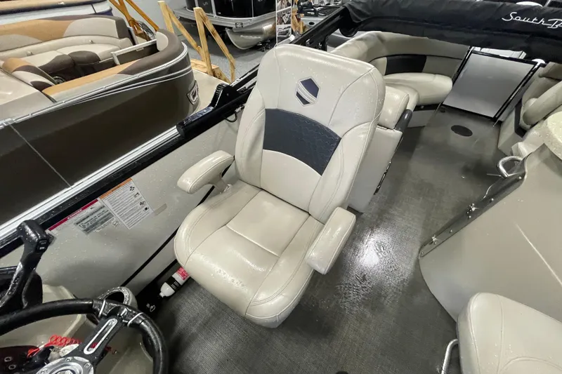 Slide: The Image of Wet dashboard of 2020 South Bay 523E 2.75 boat with steering wheel and controls. - 15