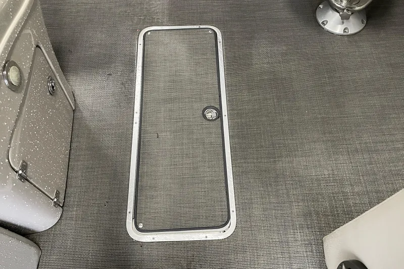 Slide: The Image of 2020 South Bay 523E 2.75 pontoon boat interior with beige seating and speaker. - 19