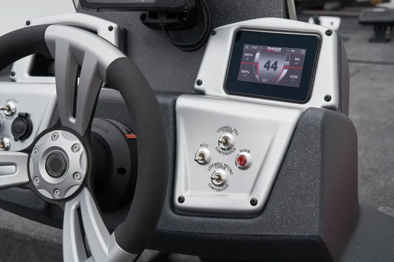 Slide: The Image of Manufacturer Provided Image: 2026 Tracker Pro Team 175 boat dashboard with steering wheel and electronic displays. - 36