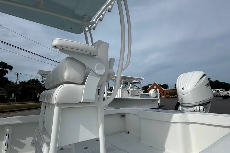 Slide: The Image of 2025 Pair Customs 24 Center Console MV boat with Yamaha outboard motor, white seating. - 4