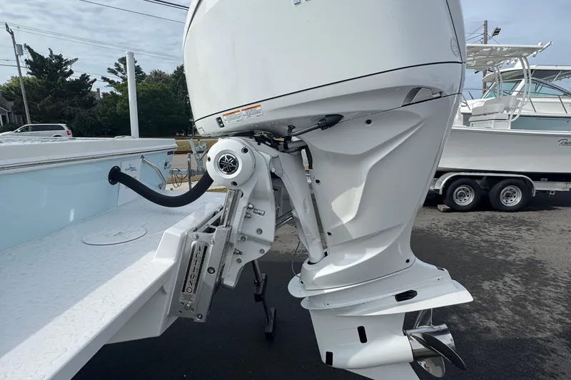 Slide: The Image of 2025 Pair Customs 24 Center Console MV with powerful outboard motor. - 6